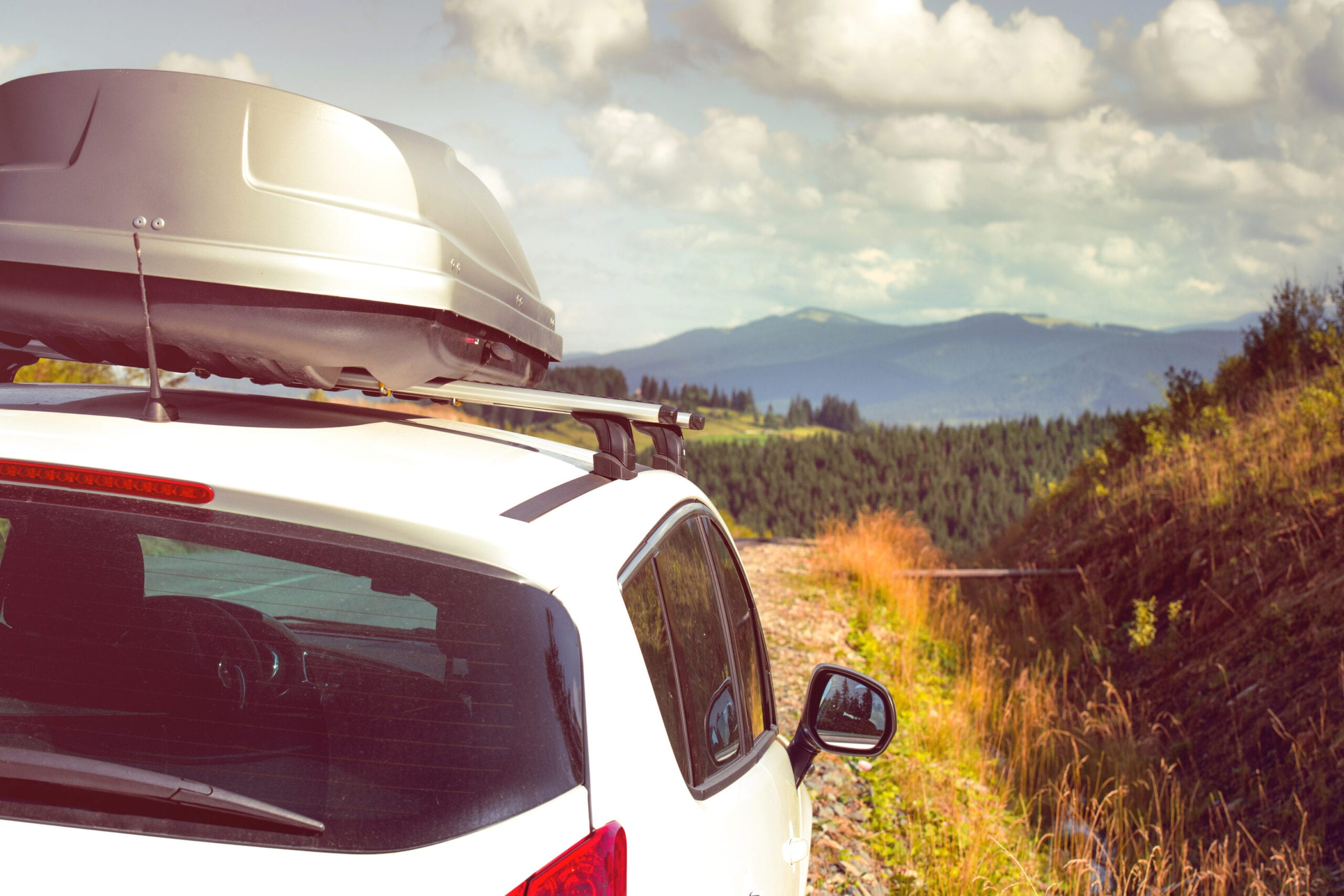 car with a roof rack car for traveling with a roof rack on a mountain road