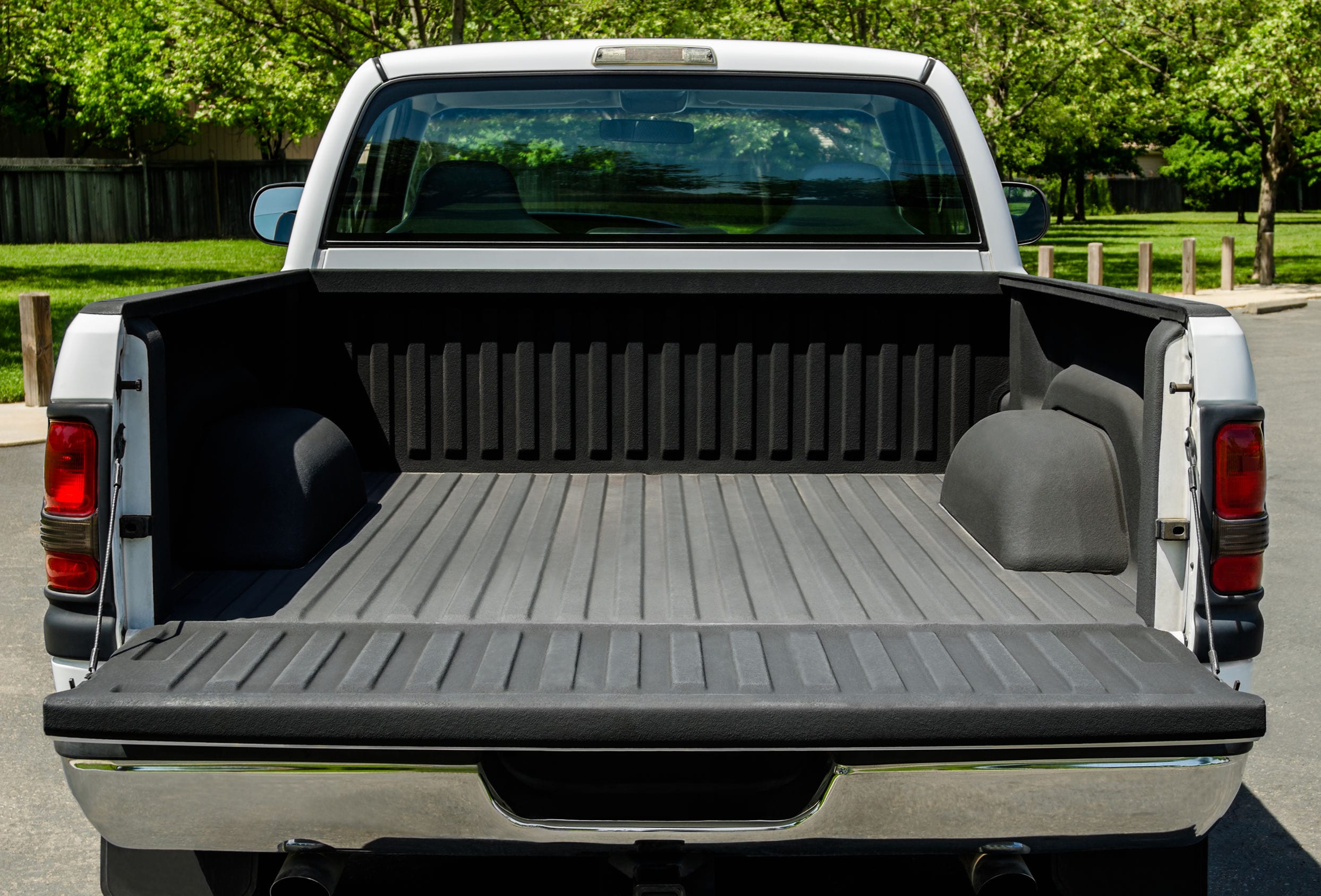 White Truck Bed White Truck Bed, empty bad of an modern white truck, daylight